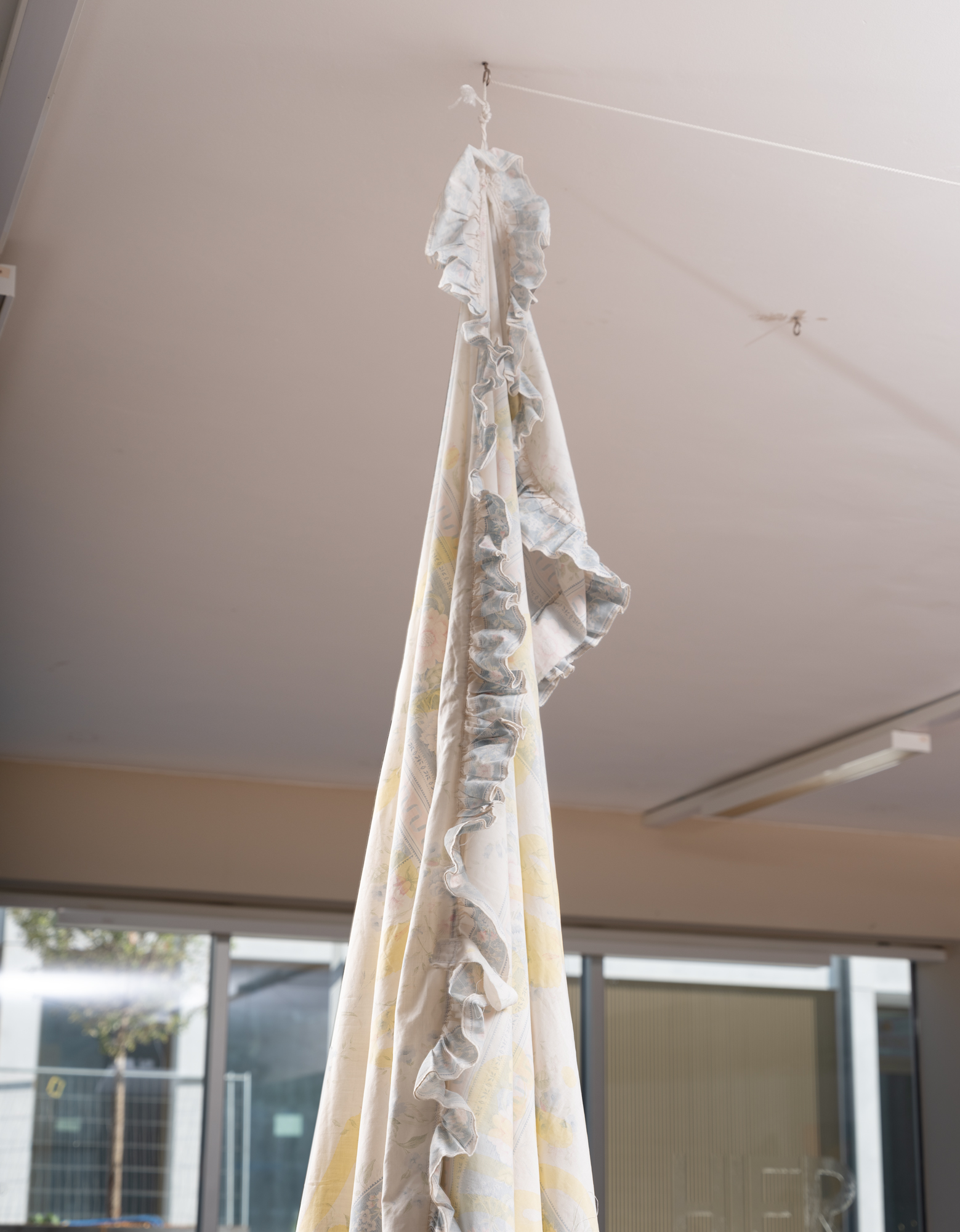 Vegetable-based ink on bed linen, loop video, ongoing performance, 2025, Sierre