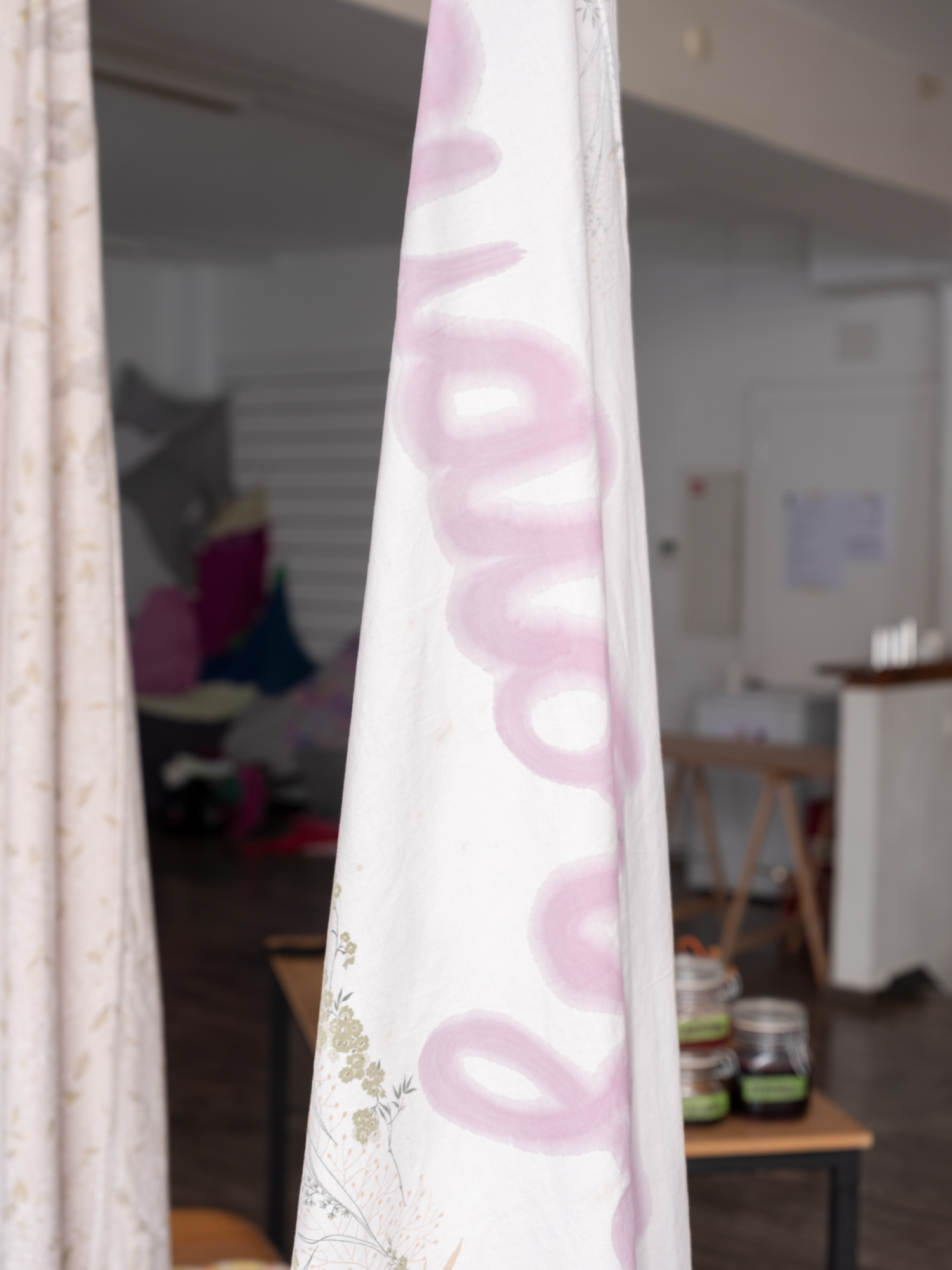 Vegetable-based ink on bed linen, loop video, ongoing performance, 2025, Sierre